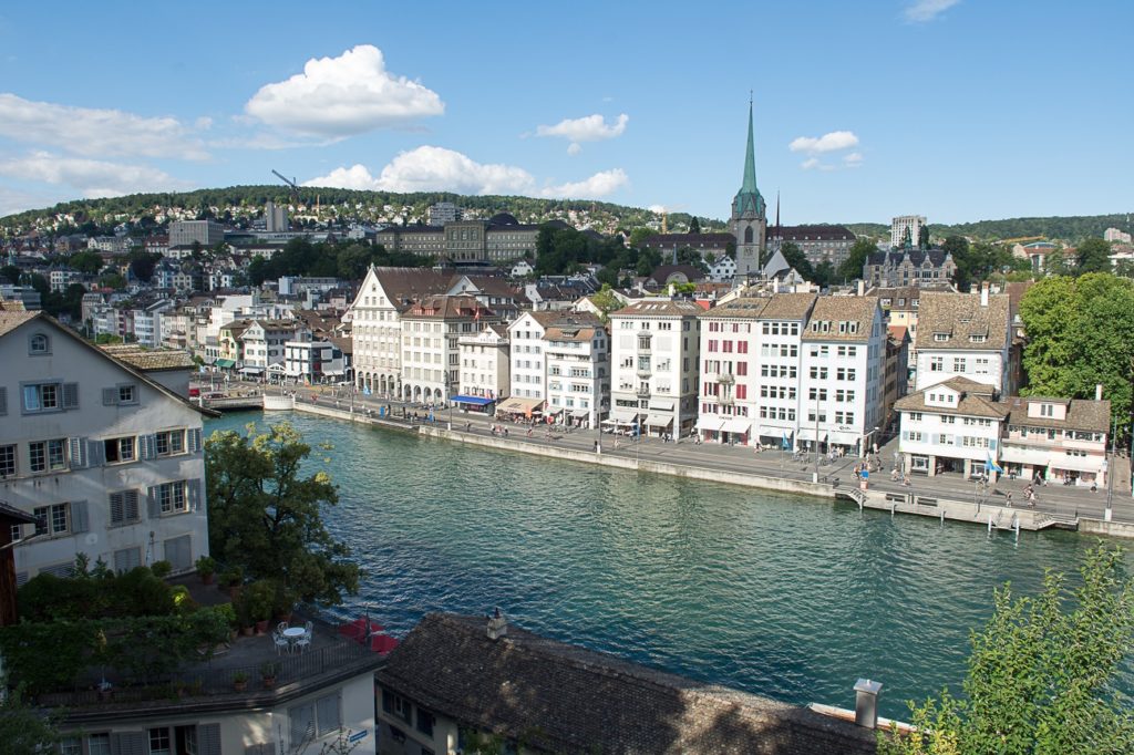 A view of Zurich along the riverbank.